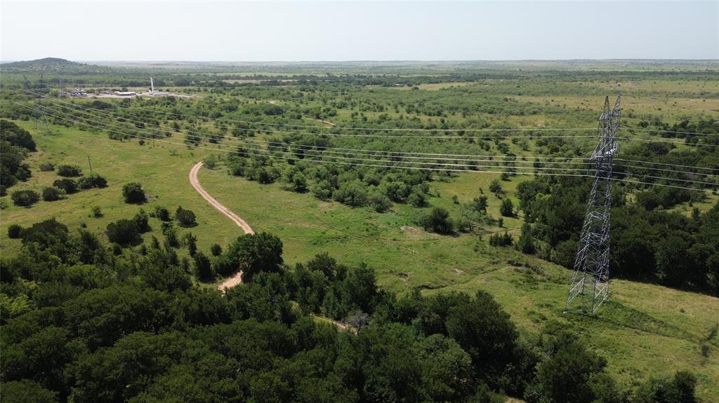 Tbd Nash Road Jacksboro, TX 76458 - Photo 25 of 28 Expansive rural landscape featuring a winding dirt road and diverse vegetation
