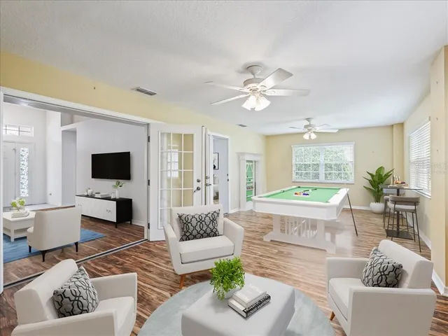 a living room with furniture or couch and a flat screen tv