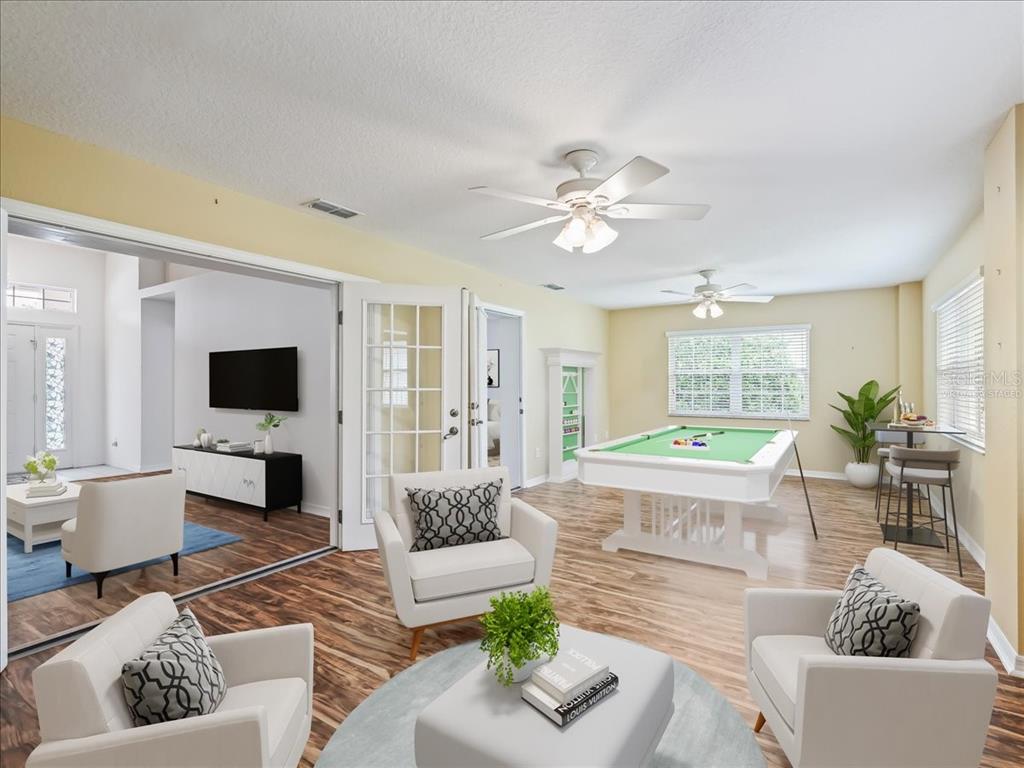 11025 Southeast 174th Loop Summerfield, FL 34491 - Photo 11 of 52 a living room with furniture or couch and a flat screen tv