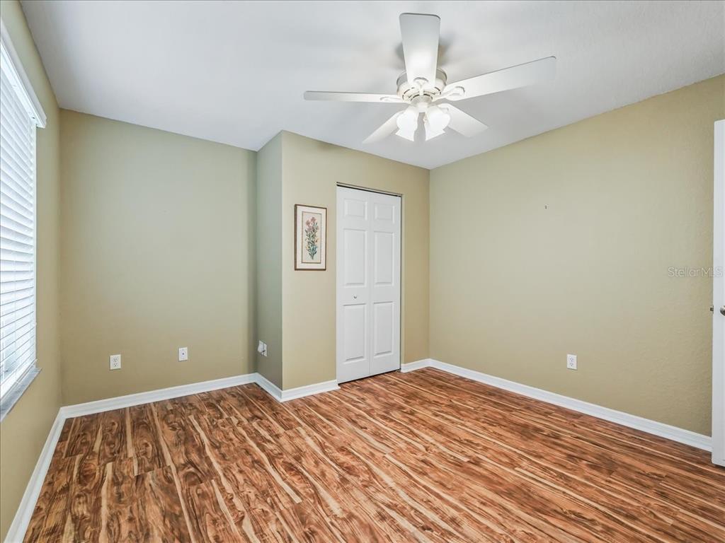 11025 Southeast 174th Loop Summerfield, FL 34491 - Photo 33 of 52 a view of a room with wooden floor and fan