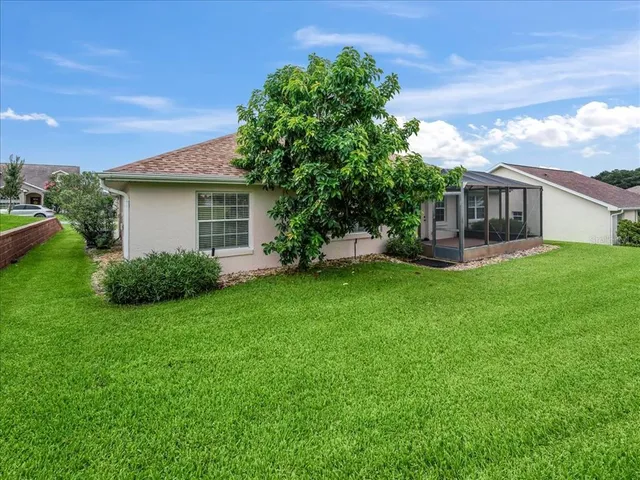 a view of a house with a yard porch and sitting area