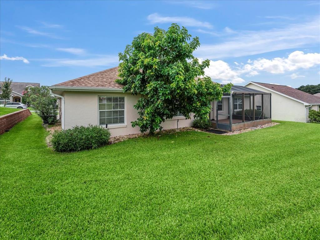11025 Southeast 174th Loop Summerfield, FL 34491 - Photo 43 of 52 a view of a house with a yard porch and sitting area