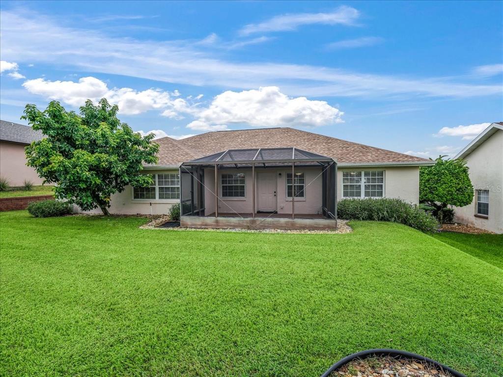 11025 Southeast 174th Loop Summerfield, FL 34491 - Photo 51 of 52 a view of a house with a backyard