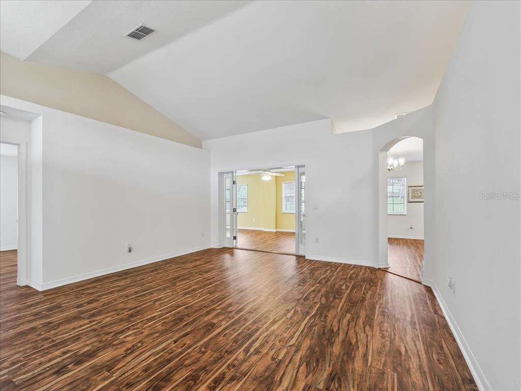 11025 Southeast 174th Loop Summerfield, FL 34491 - Photo 6 of 52 a view of empty room with wooden floor and fan