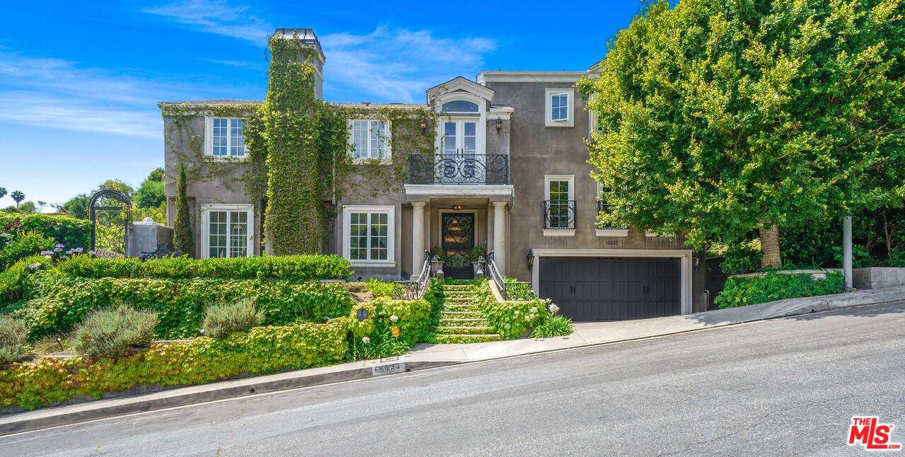 16632 Bienveneda Place Pacific Palisades, CA 90272 - Photo 1 of 62 front view of a house with a yard