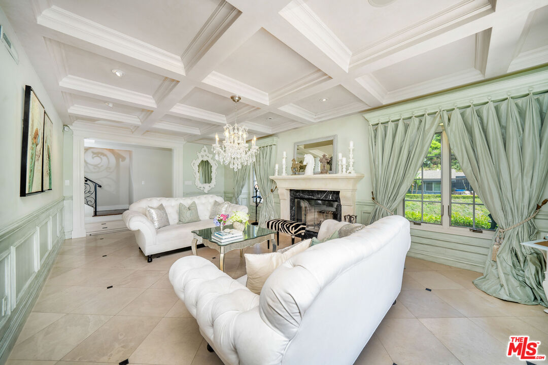 16632 Bienveneda Place Pacific Palisades, CA 90272 - Photo 12 of 62 a living room with furniture and a large window
