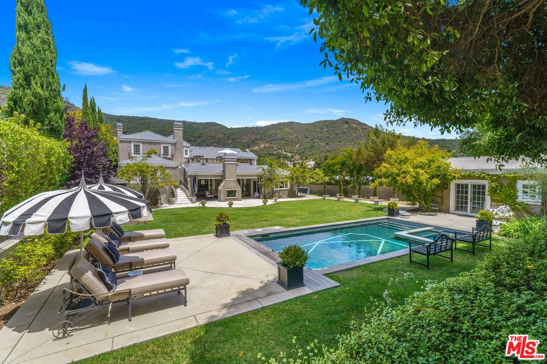 16632 Bienveneda Place Pacific Palisades, CA 90272 - Photo 2 of 62 a view of a house with a yard porch and sitting area