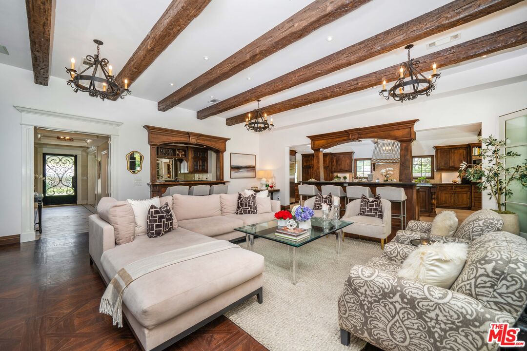16632 Bienveneda Place Pacific Palisades, CA 90272 - Photo 21 of 62 a living room with furniture and a large window