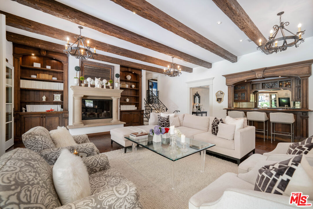 16632 Bienveneda Place Pacific Palisades, CA 90272 - Photo 22 of 62 a living room with furniture fireplace and flat screen tv