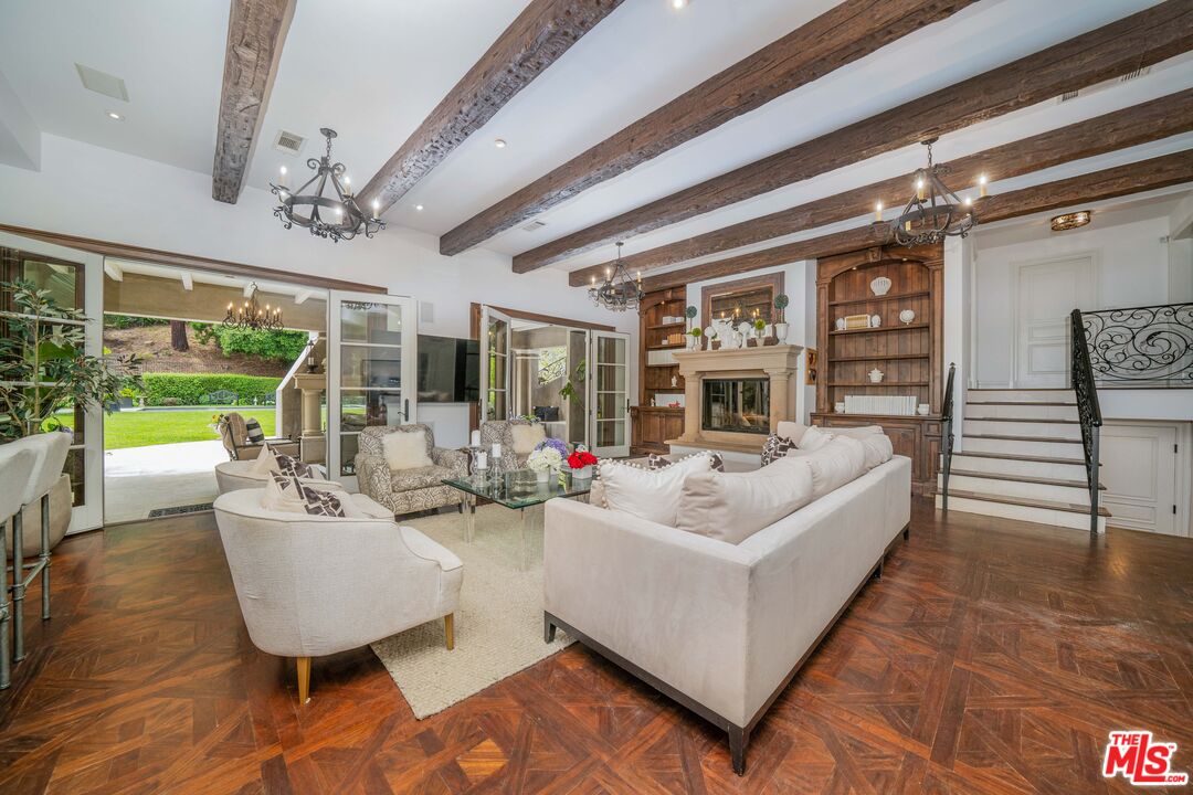 16632 Bienveneda Place Pacific Palisades, CA 90272 - Photo 24 of 62 a living room with furniture and a large window