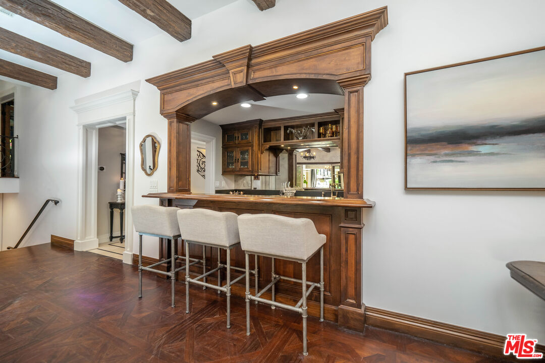 16632 Bienveneda Place Pacific Palisades, CA 90272 - Photo 25 of 62 a view of a dining room with furniture and wooden floor