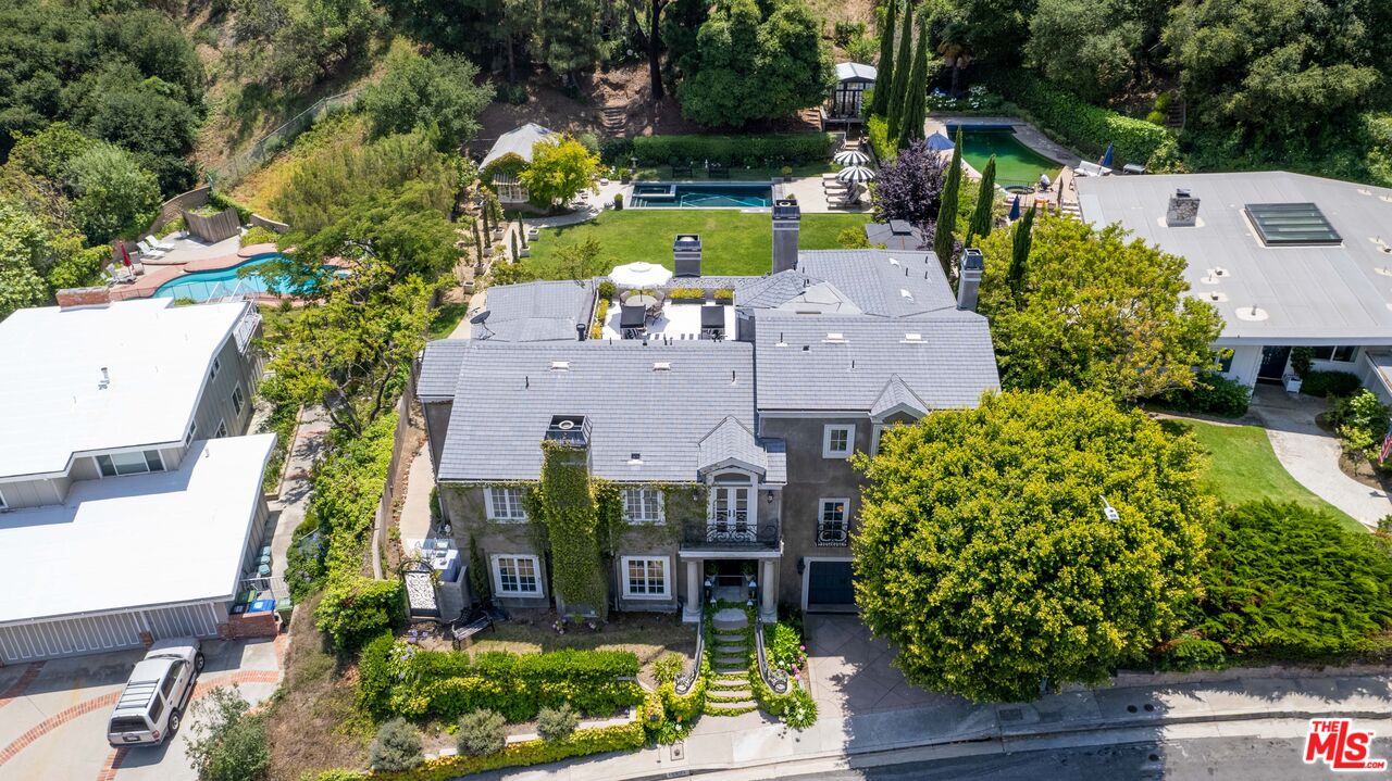 16632 Bienveneda Place Pacific Palisades, CA 90272 - Photo 3 of 62 an aerial view of a house with a garden statue
