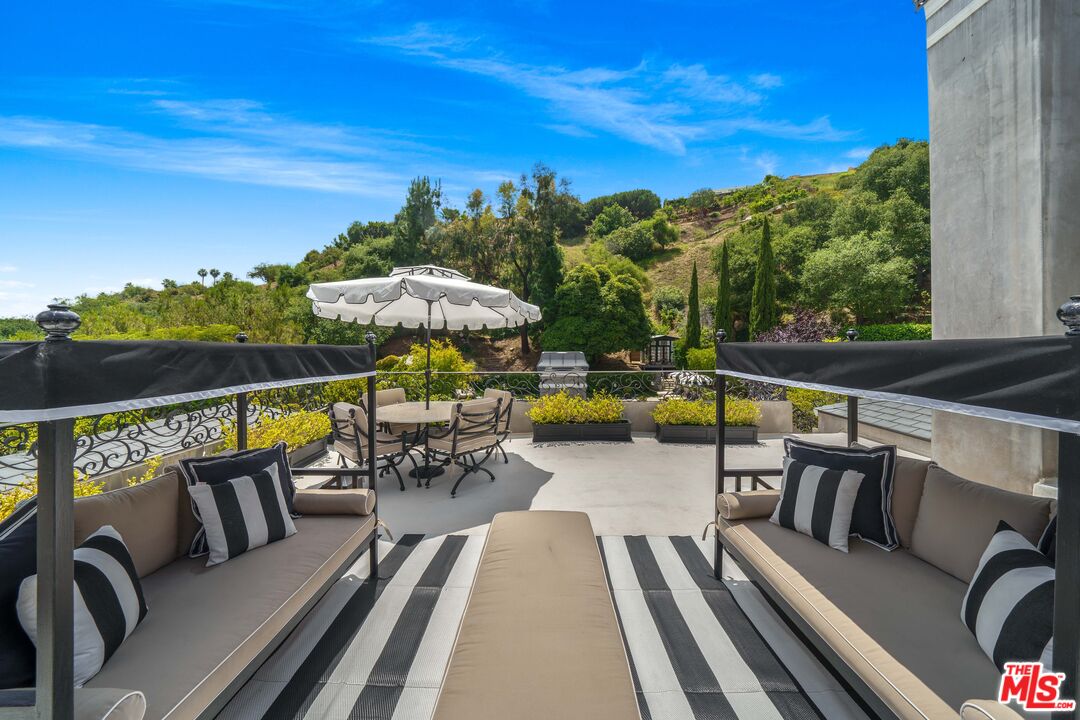 16632 Bienveneda Place Pacific Palisades, CA 90272 - Photo 38 of 62 a view of a chairs and table in the balcony