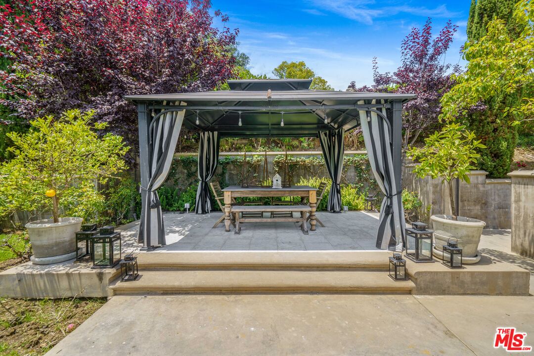 16632 Bienveneda Place Pacific Palisades, CA 90272 - Photo 48 of 62 a view of backyard with sitting area and garden
