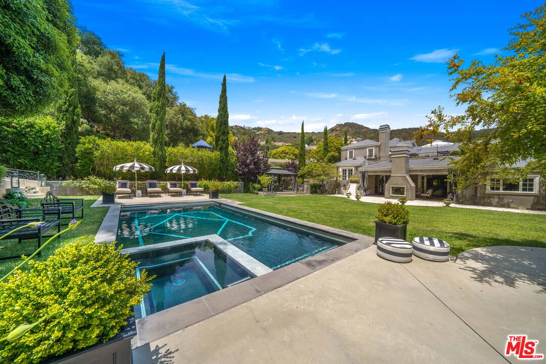 16632 Bienveneda Place Pacific Palisades, CA 90272 - Photo 57 of 62 a view of a house with a swimming pool