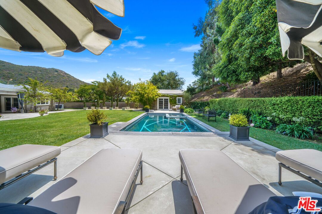 16632 Bienveneda Place Pacific Palisades, CA 90272 - Photo 58 of 62 a view of yard with swimming pool and green space