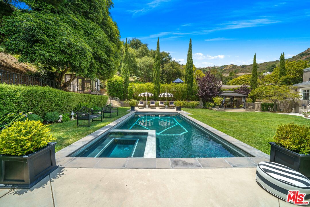 16632 Bienveneda Place Pacific Palisades, CA 90272 - Photo 59 of 62 a view of a swimming pool with a patio