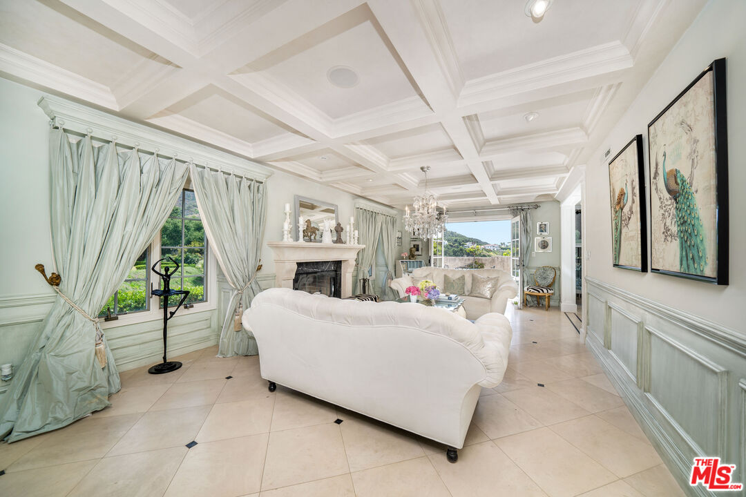 16632 Bienveneda Place Pacific Palisades, CA 90272 - Photo 6 of 62 a bed room with a bed and a large window