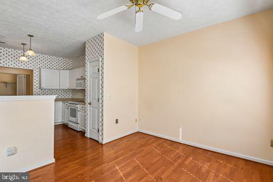 9511 Kingscroft Terrace, Unit 9511F Perry Hall, MD 21128 - Photo 24 of 38 a view of a kitchen with a sink and a refrigerator