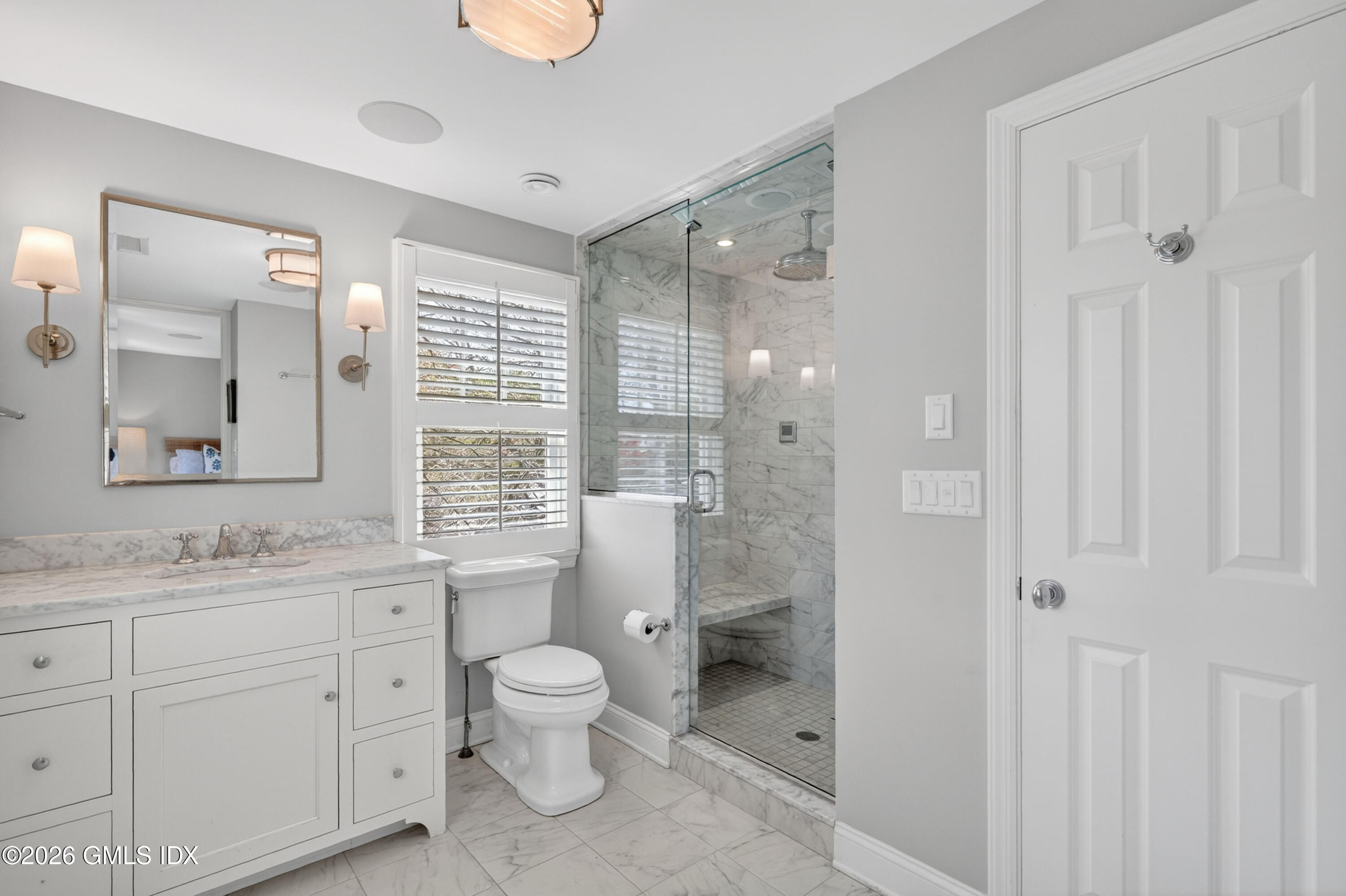 20 Ridge Road Cos Cob, CT 06807 - Photo 23 of 36 a bathroom with a toilet a sink and a large mirror