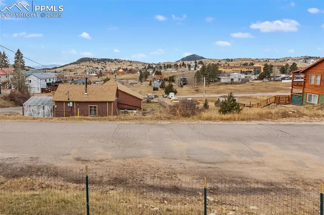 a view of a house with backyard and chair