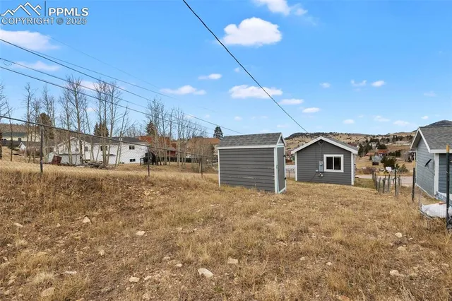 an aerial view of residential houses with outdoor space