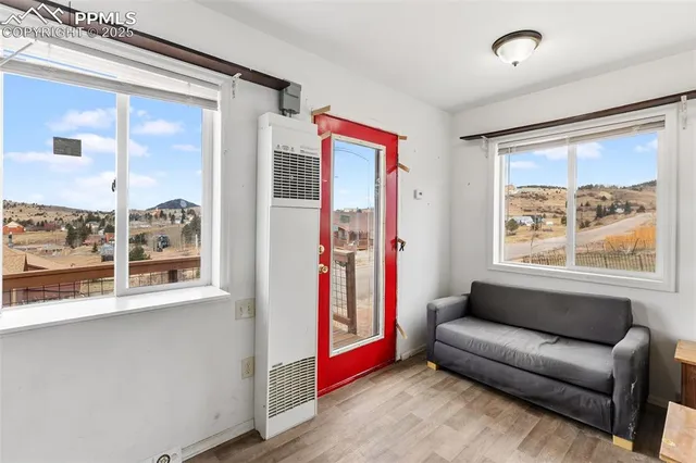 a living room with a couch and a window
