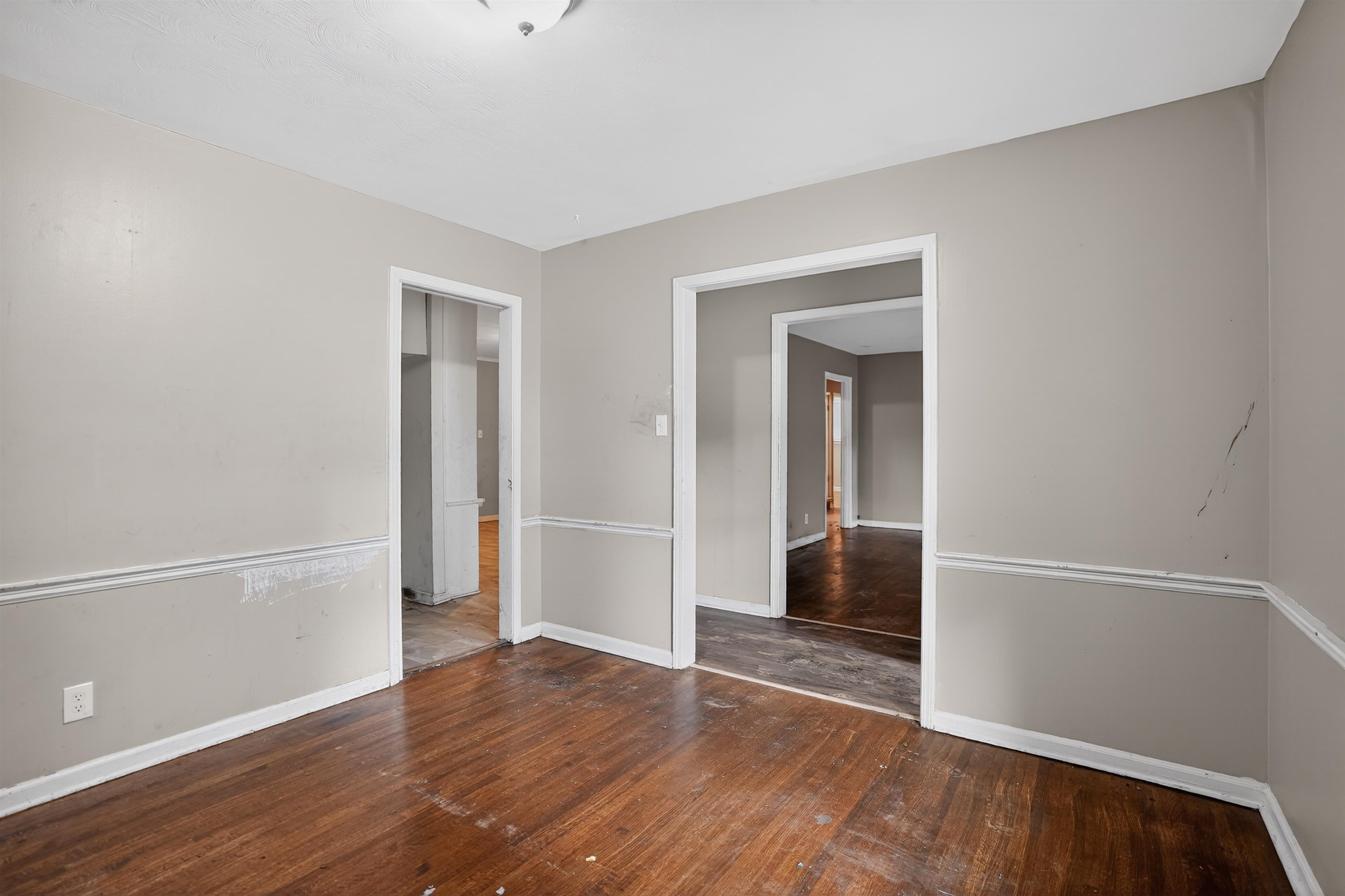 1890 Pennel Road Memphis, TN 38116 - Photo 18 of 25 Room featuring wood-finish flooring, neutral wall paint, and white trim