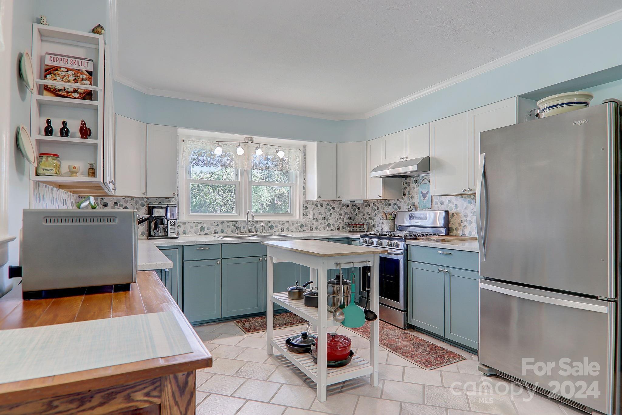 6093 Poors Ford Road Rutherfordton, NC 28139 - Photo 24 of 48 a kitchen with a sink a refrigerator and a stove top oven
