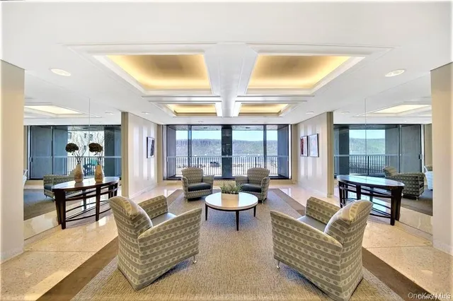 a view of a swimming pool with a table and chairs