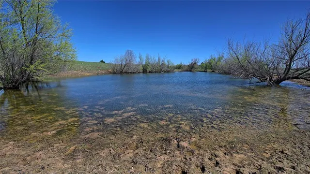 a view of lake with mountain in the back