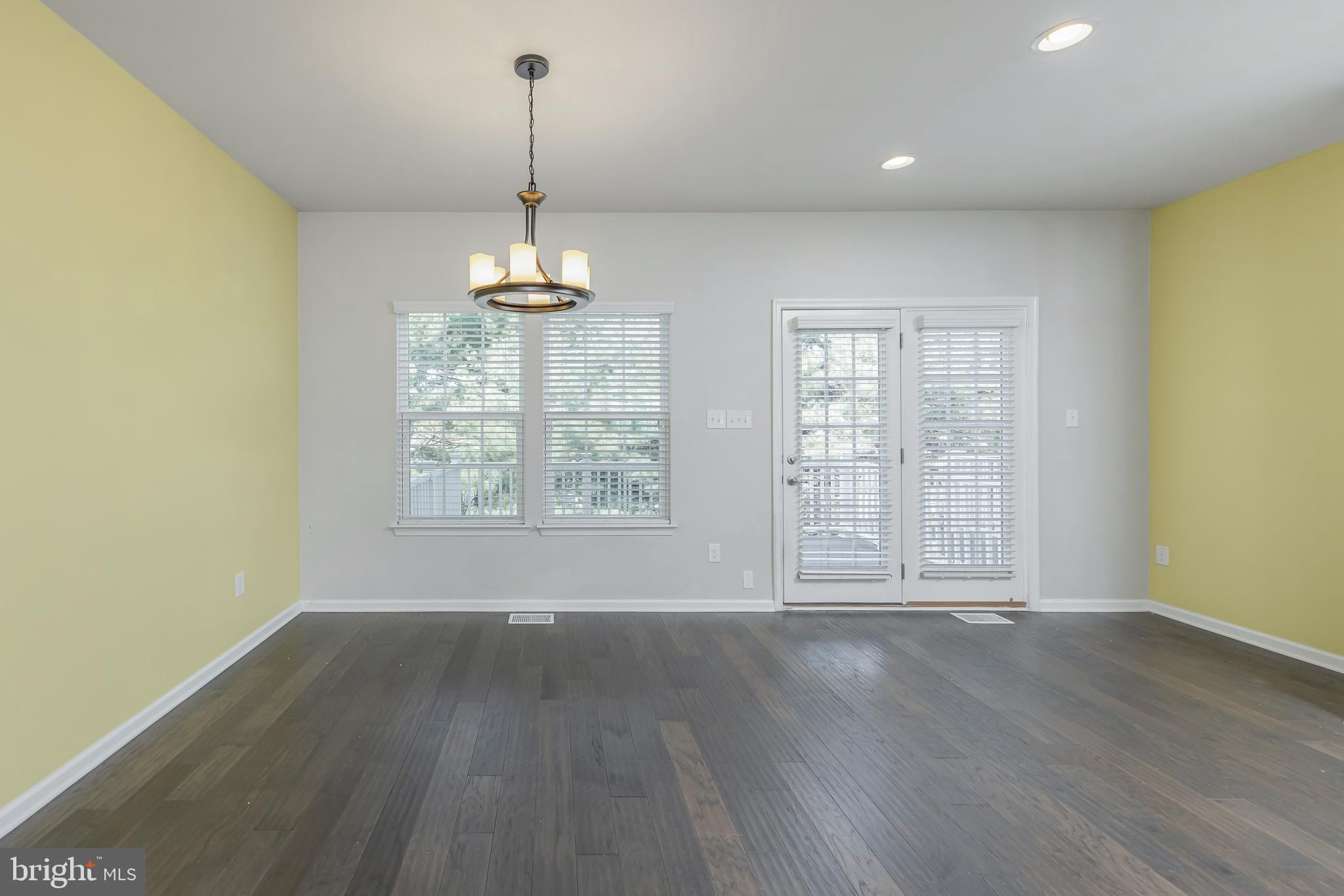 1036 Regency Place Sewell, NJ 08080 - Photo 11 of 18 wooden floor in an empty room with a window