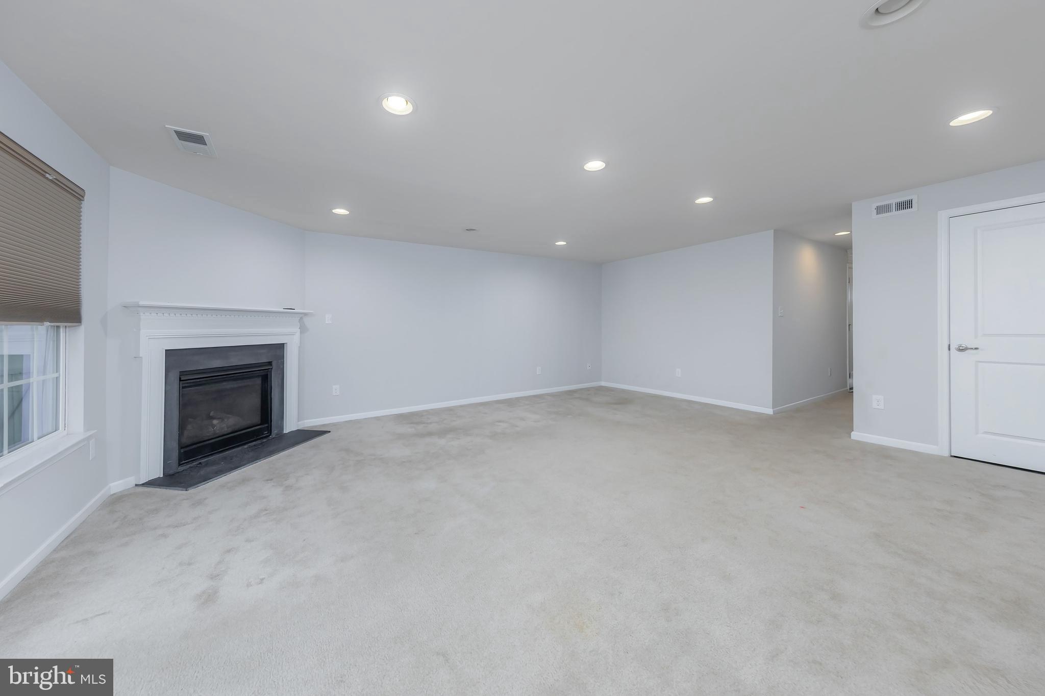 1036 Regency Place Sewell, NJ 08080 - Photo 4 of 18 a view of empty room with a fireplace