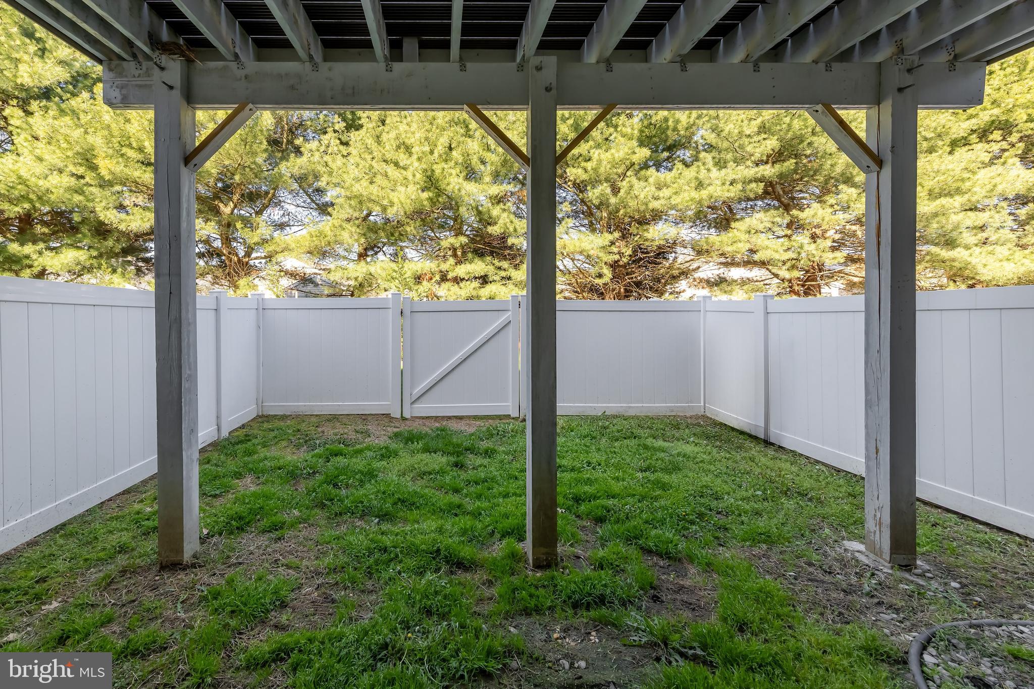 1036 Regency Place Sewell, NJ 08080 - Photo 5 of 18 a view of a backyard with plants