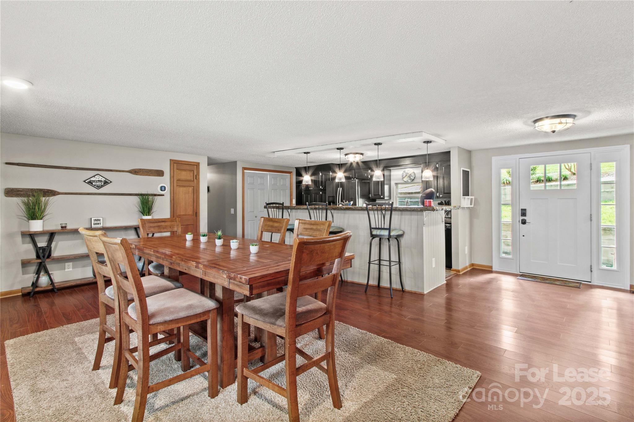 173 Waddell Road Mooresville, NC 28117 - Photo 13 of 47 a dining area with furniture and wooden floor