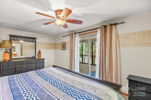 a room with a bed and a dresser