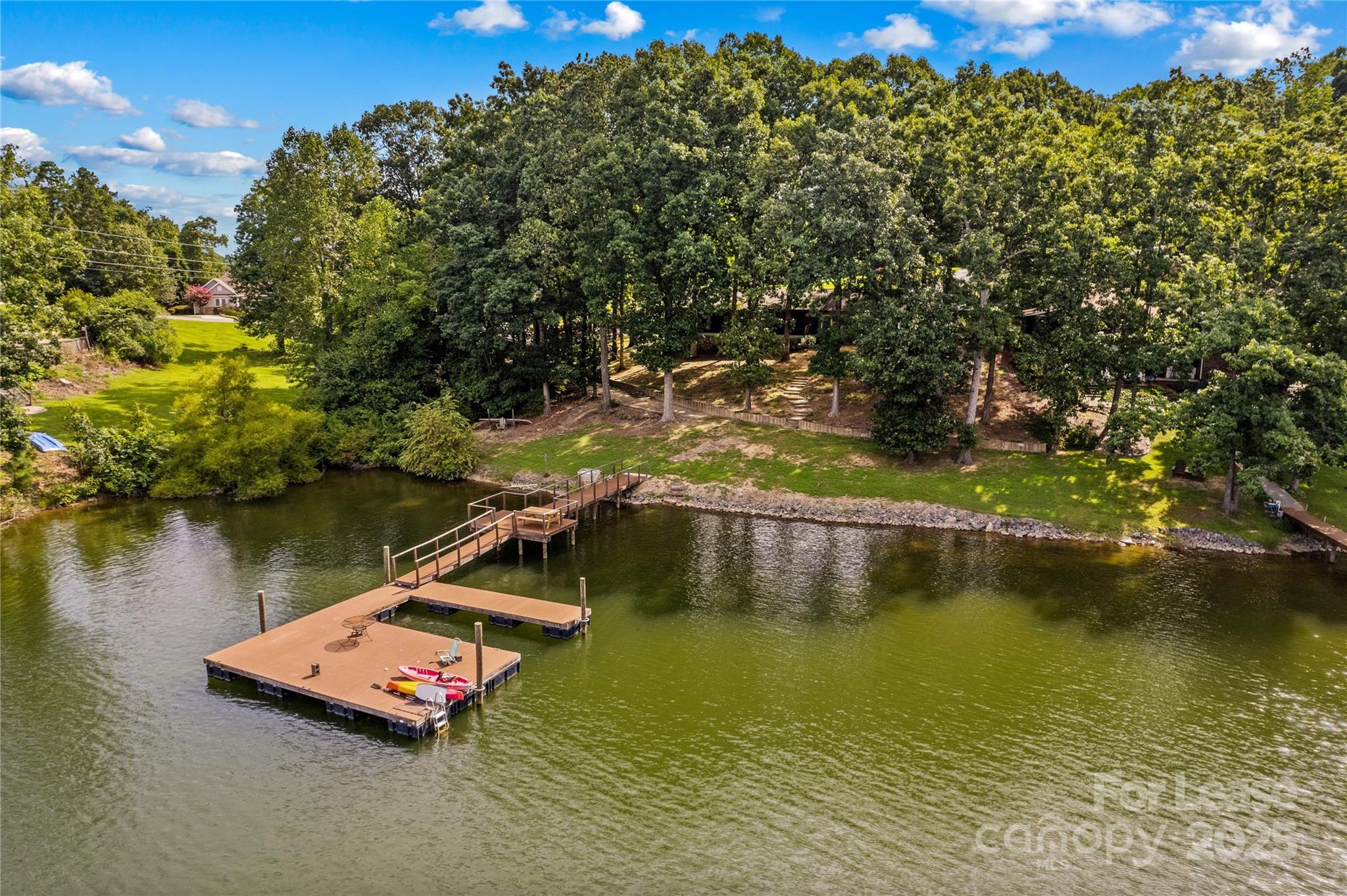 173 Waddell Road Mooresville, NC 28117 - Photo 3 of 47 a view of a lake with a mountain