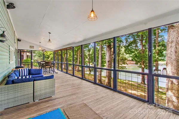 a living room with wooden floor and furniture