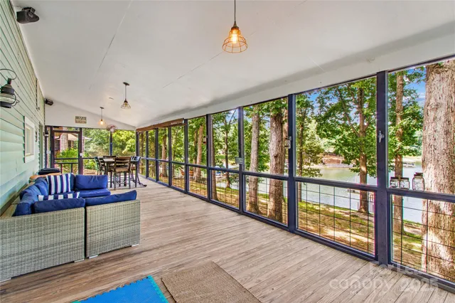 a living room with wooden floor and furniture