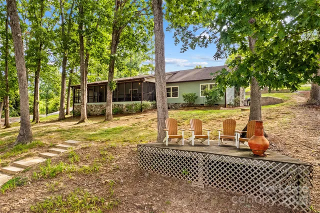 a view of a patio with table and chairs and couches