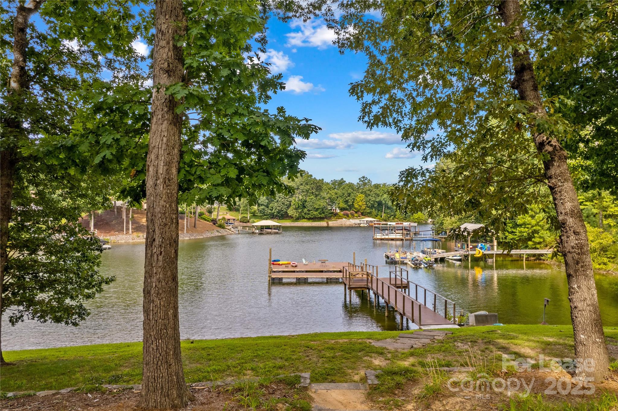 173 Waddell Road Mooresville, NC 28117 - Photo 45 of 47 a view of a lake with houses in the background