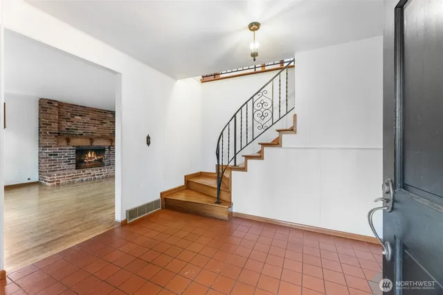 a view of entryway and hall with a window