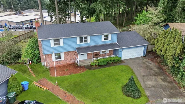 a aerial view of a house with a yard