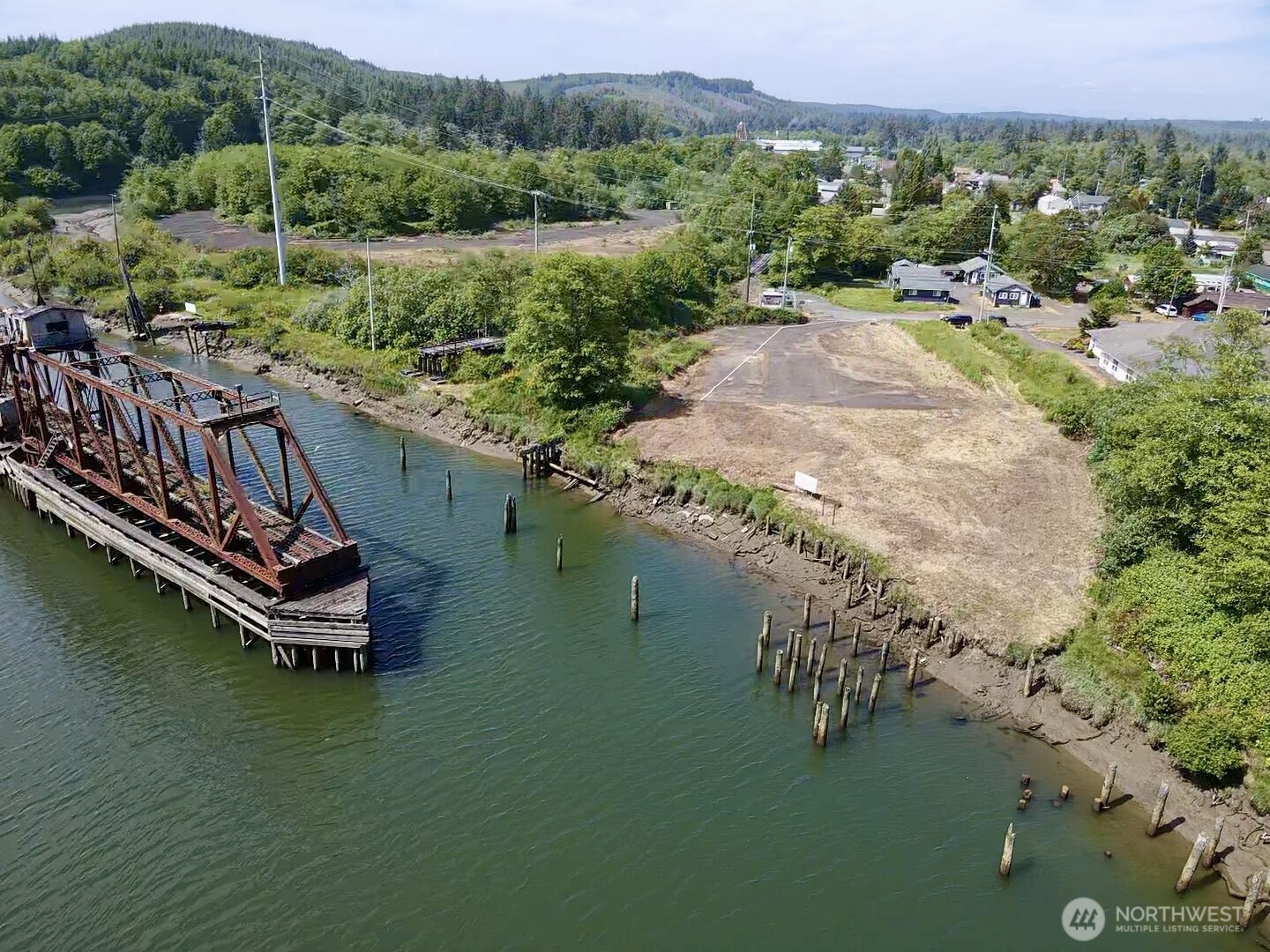 1010 Division Street Hoquiam, WA 98550 - Photo 12 of 40 a view of a lake with a mountain