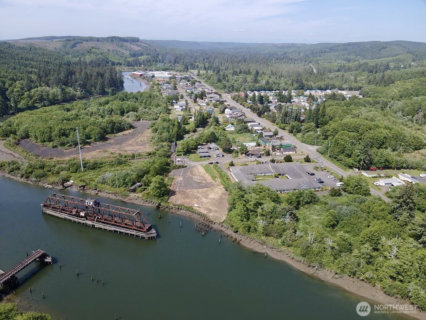 1010 Division Street Hoquiam, WA 98550 - Photo 12 of 40 an aerial view of a house with a garden and lake view