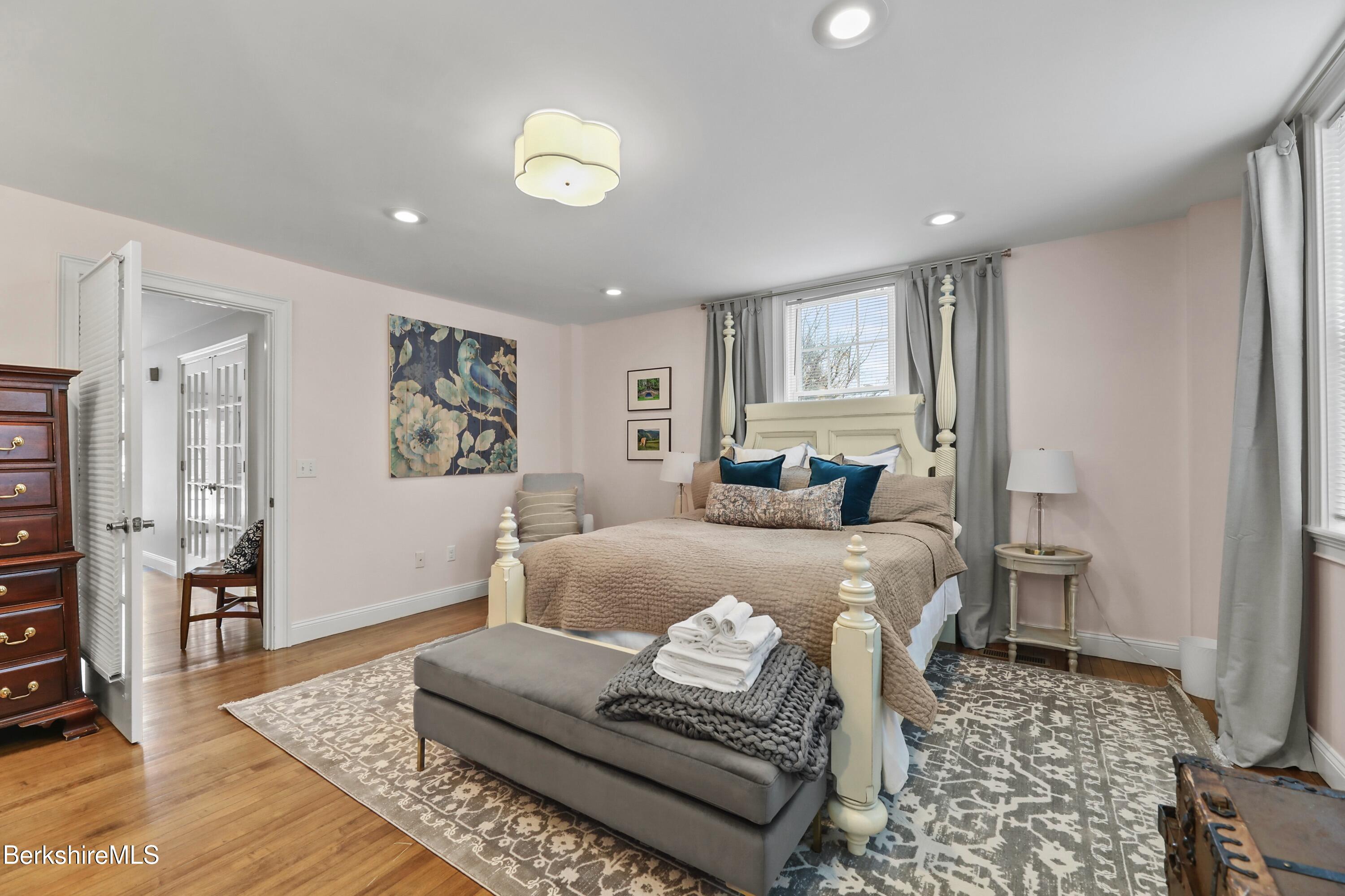 1 Devon Road Stockbridge, MA 01262 - Photo 38 of 58 a bedroom with a bed and wooden floor