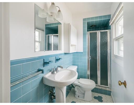 18 Pamela Road Framingham, MA 01701 - Photo 11 of 20 a bathroom with a sink a toilet and mirror