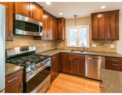 18 Pamela Road Framingham, MA 01701 - Photo 3 of 20 a kitchen with stainless steel appliances granite countertop a stove a sink and a microwave