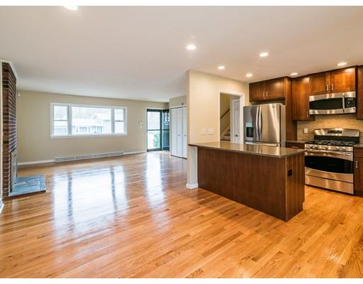 18 Pamela Road Framingham, MA 01701 - Photo 5 of 20 a kitchen with stainless steel appliances kitchen island granite countertop a large counter top and wooden floors