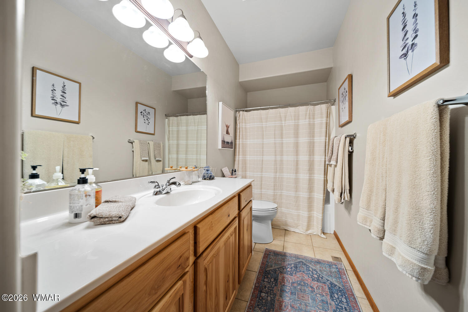 1041 South Pinon Circle Show Low, AZ 85901 - Photo 13 of 29 a bathroom with a sink a mirror and a shower